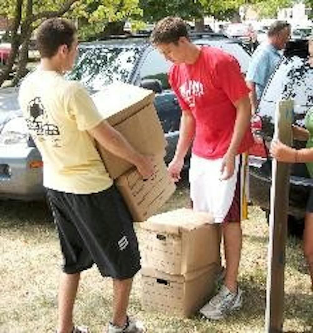 Sophomores Eric Hinkle and Matt Diamond move into their residence hall Saturday.