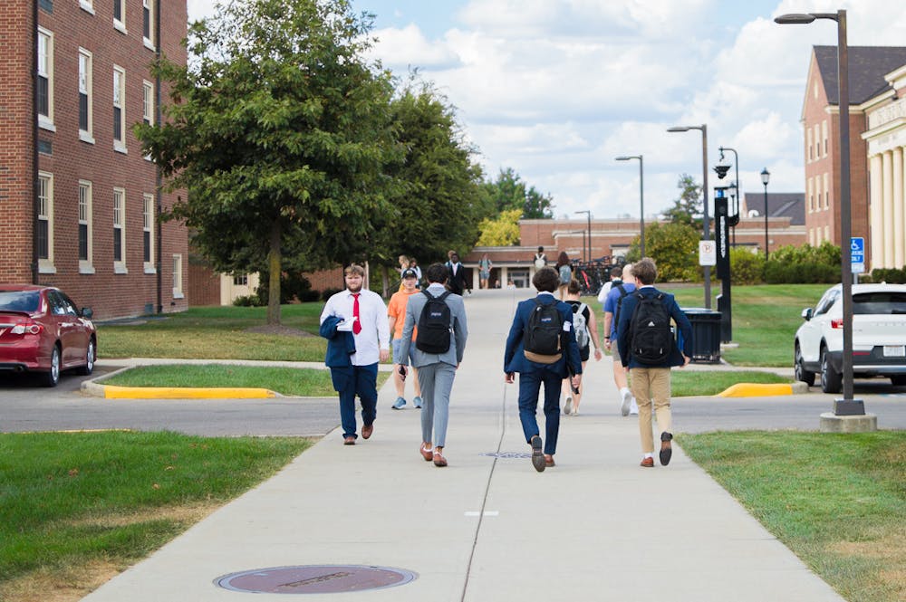 <p>Students walk through North quad on the way back from their classes.</p>