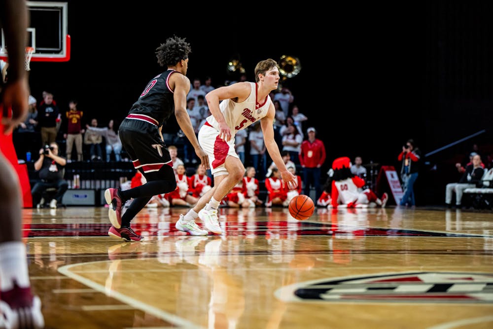 Junior guard Peter Suder dribbling against Troy on Feb. 8 at Millett Hall