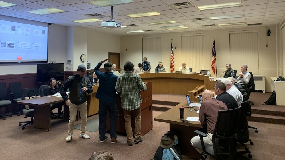 Oxford City Council's Dec. 6 meeting began with an entertaining presentation as members of the Oxford Farmers Market sang a parody of Queen's "We Will Rock You," called "We Will Feed You." Another member gave audience members apples as they performed.