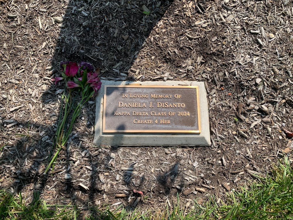 The tree that accompanies the above plaque was planted to honor Miami student Daniela DiSanto, who died in August of 2021.