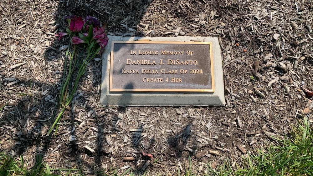 The tree that accompanies the above plaque was planted to honor Miami student Daniela DiSanto, who died in August of 2021.
