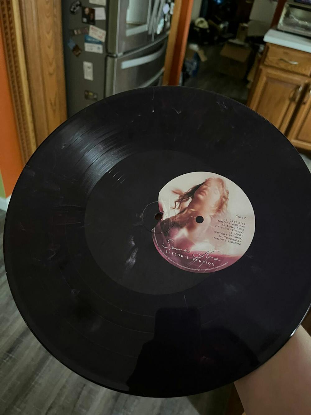 Asst. C&C Editor Stella Powers has had several bad experiences when it comes to buying merch from her favorite artists – this is her copy of “Speak Now (Taylor’s Version)” with a misplaced sticker.