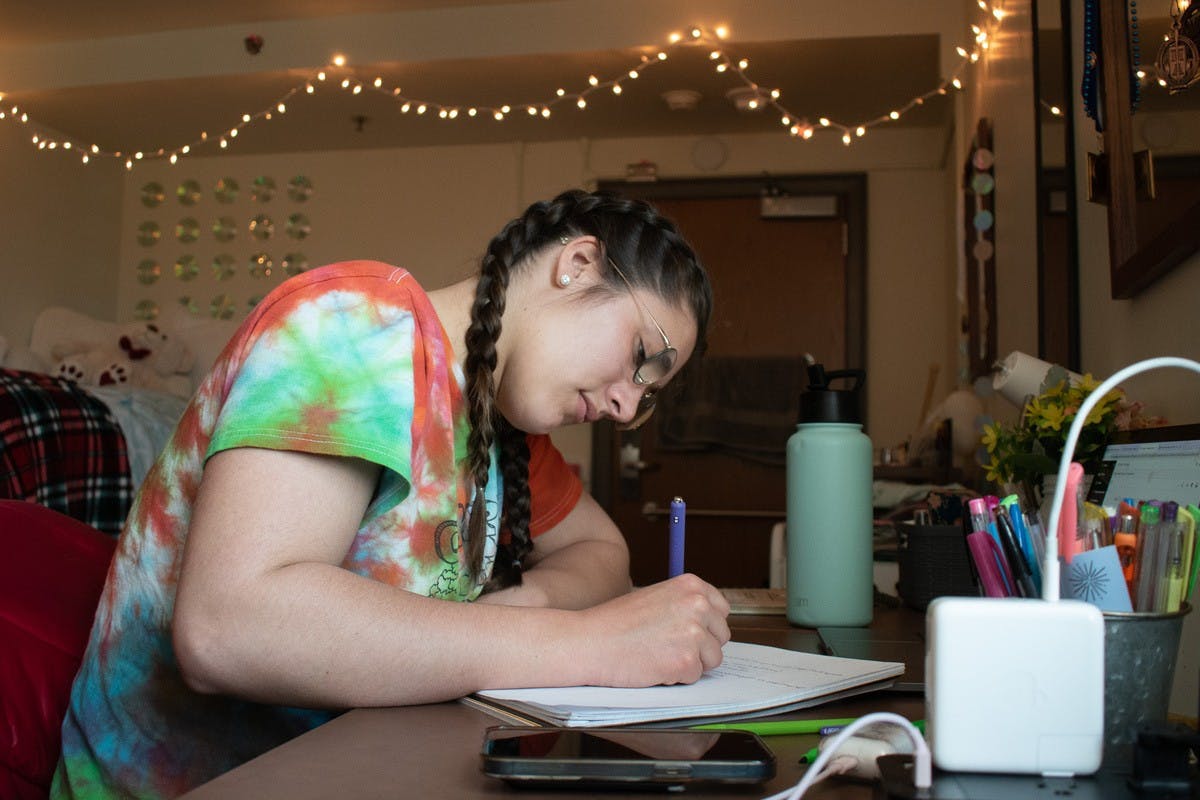 Catelyn Collins studies for the LSAT in her dorm room.