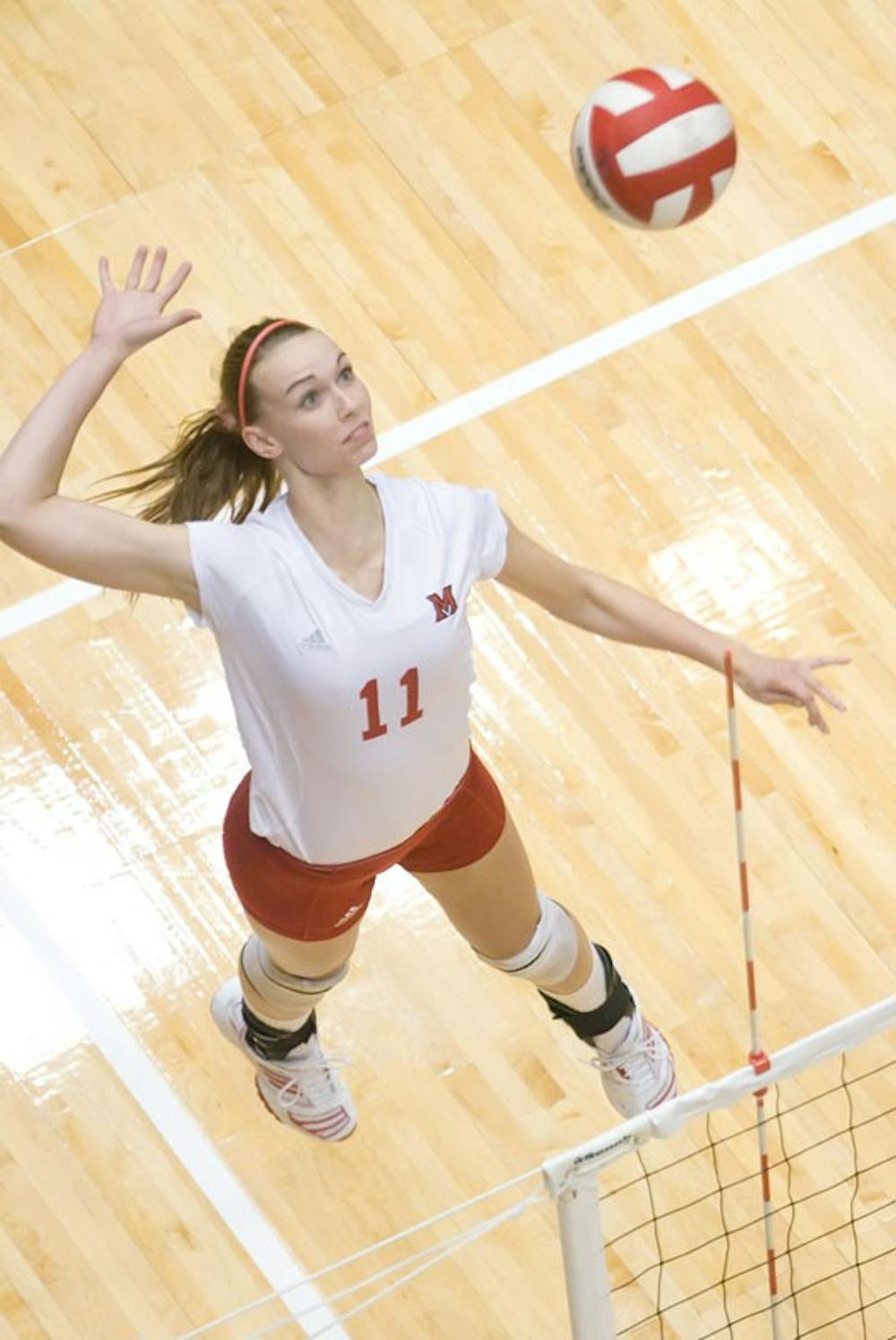 Michele Metzler goes up for a spike during a game at Millett Hall.