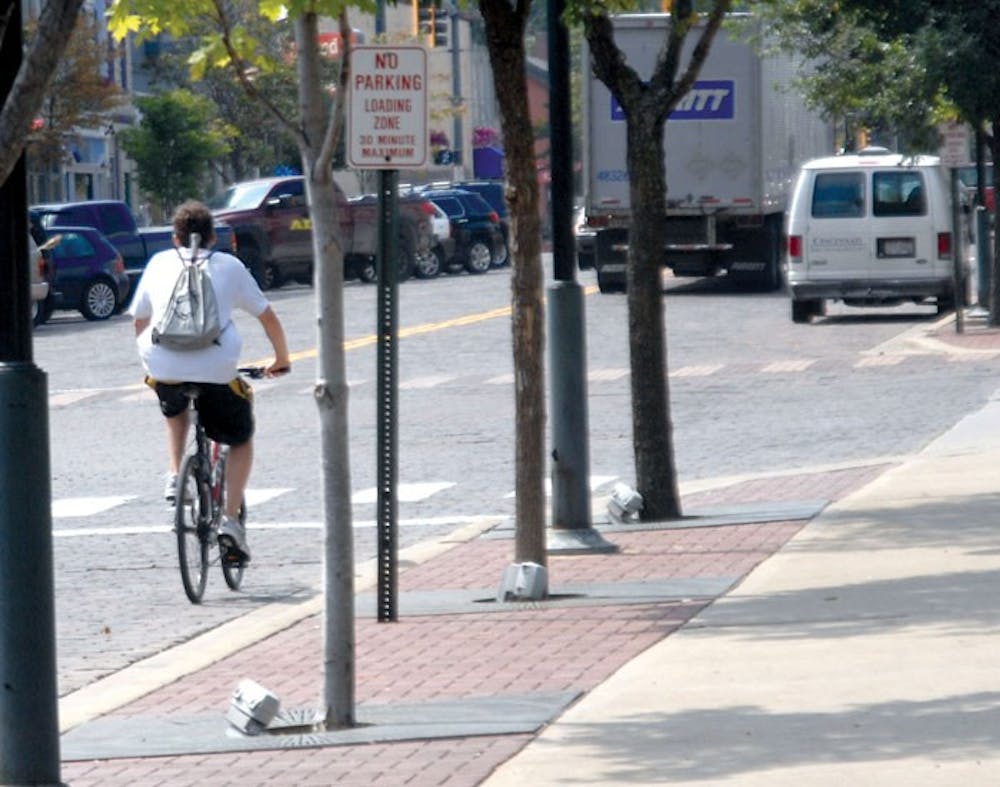 Bikers who use sidewalks in the uptown district or violate traffic laws could be  issued a $60 fine for a civil citation or a $180 fine for a uniform statewide citation. 