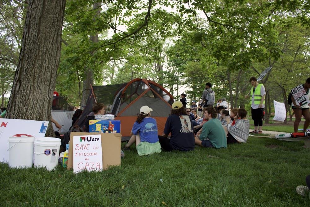 Protesters encircle tents in Academic Quad