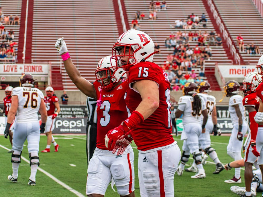 Senior defensive back Mike Brown and redshirt freshman defensive back Matthew Salopek celebrate during Miami's Oct. 2 28-17 win against Central Michigan.