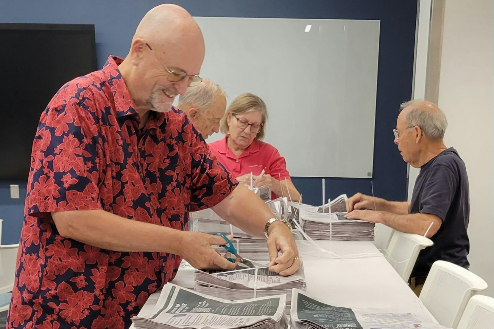 Mayor Bill Snavely volunteers to distribute Oxford Free Press papers one Friday morning.