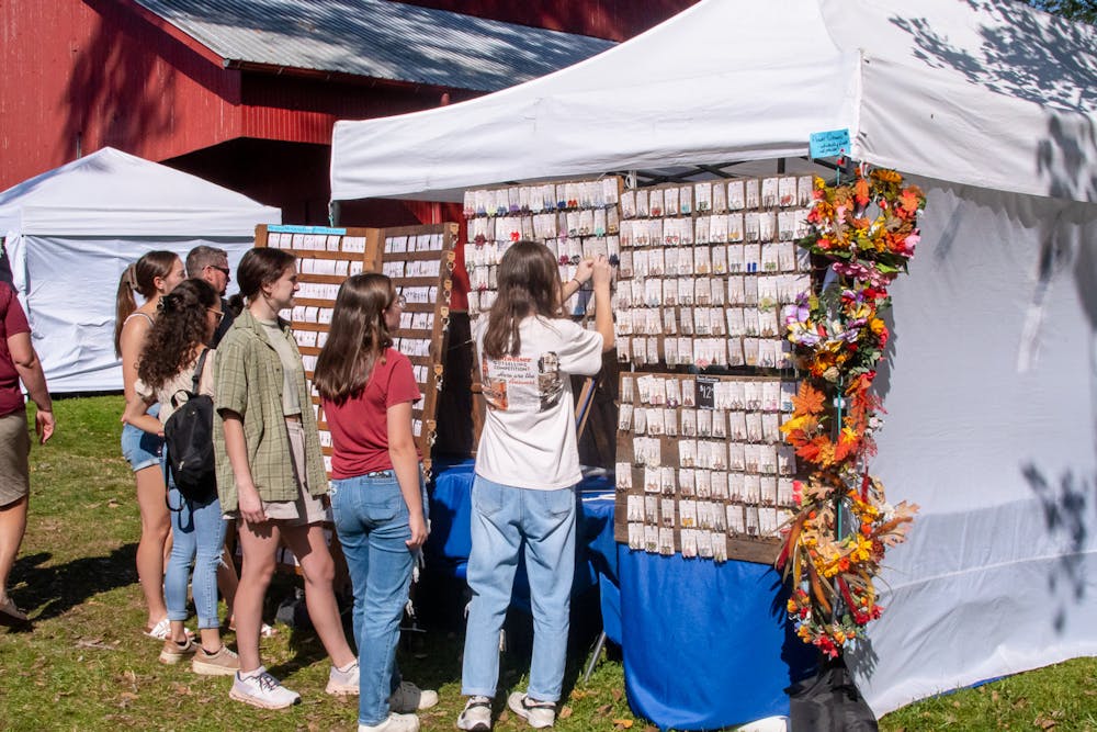 Visitors to the festival explore the large jewelry selection.