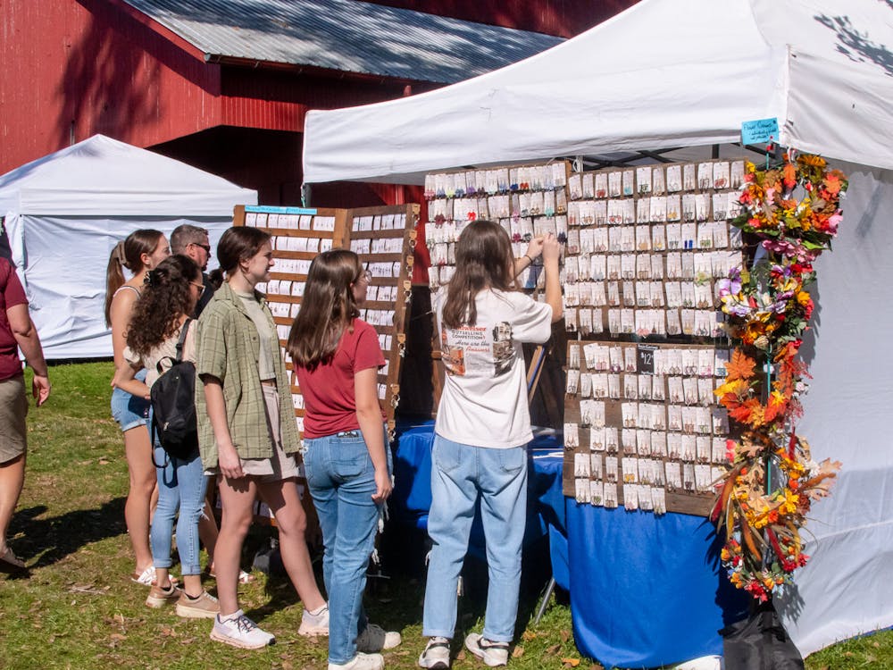 Visitors to the festival explore the large jewelry selection.