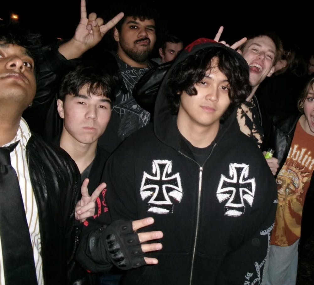 <p>Miami University sophomore Andrew Solomon pictured with friends and fans.</p>