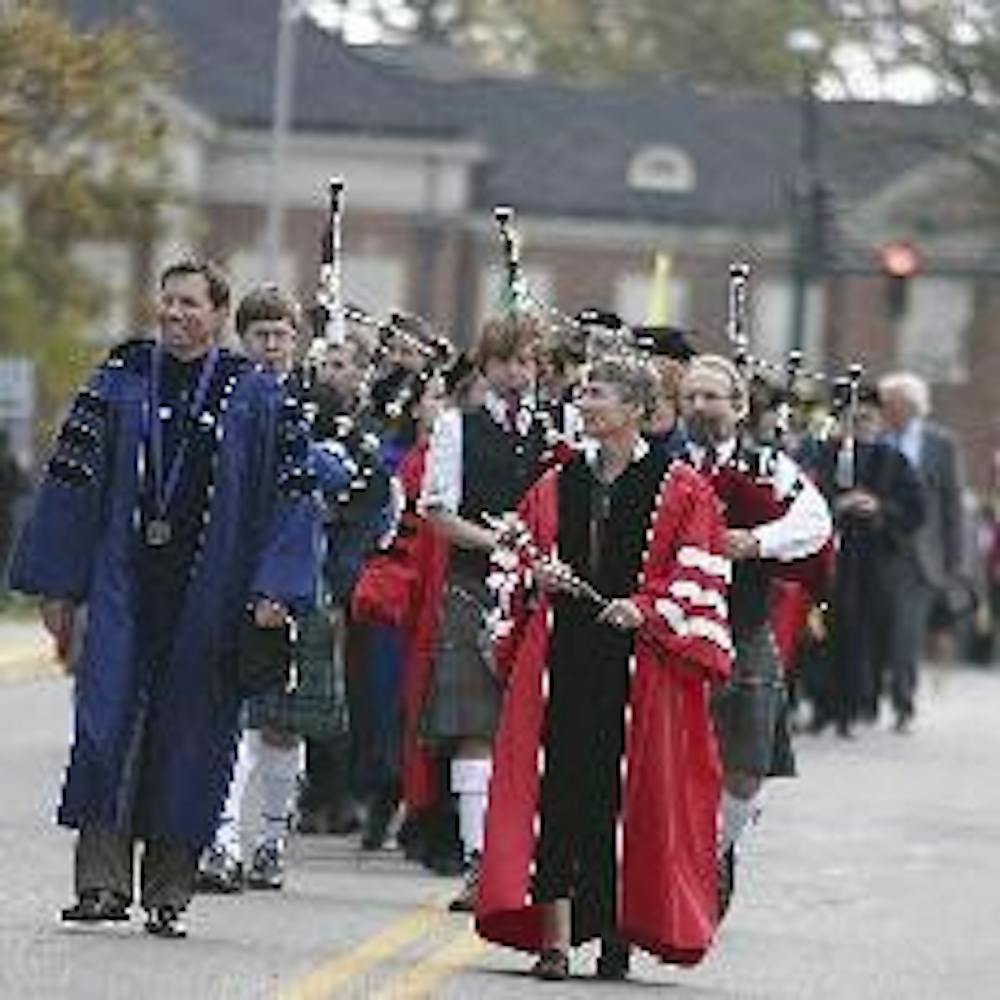 President Hodge walks in the academic procession from the Hub to Millett Hall Friday afternoon.