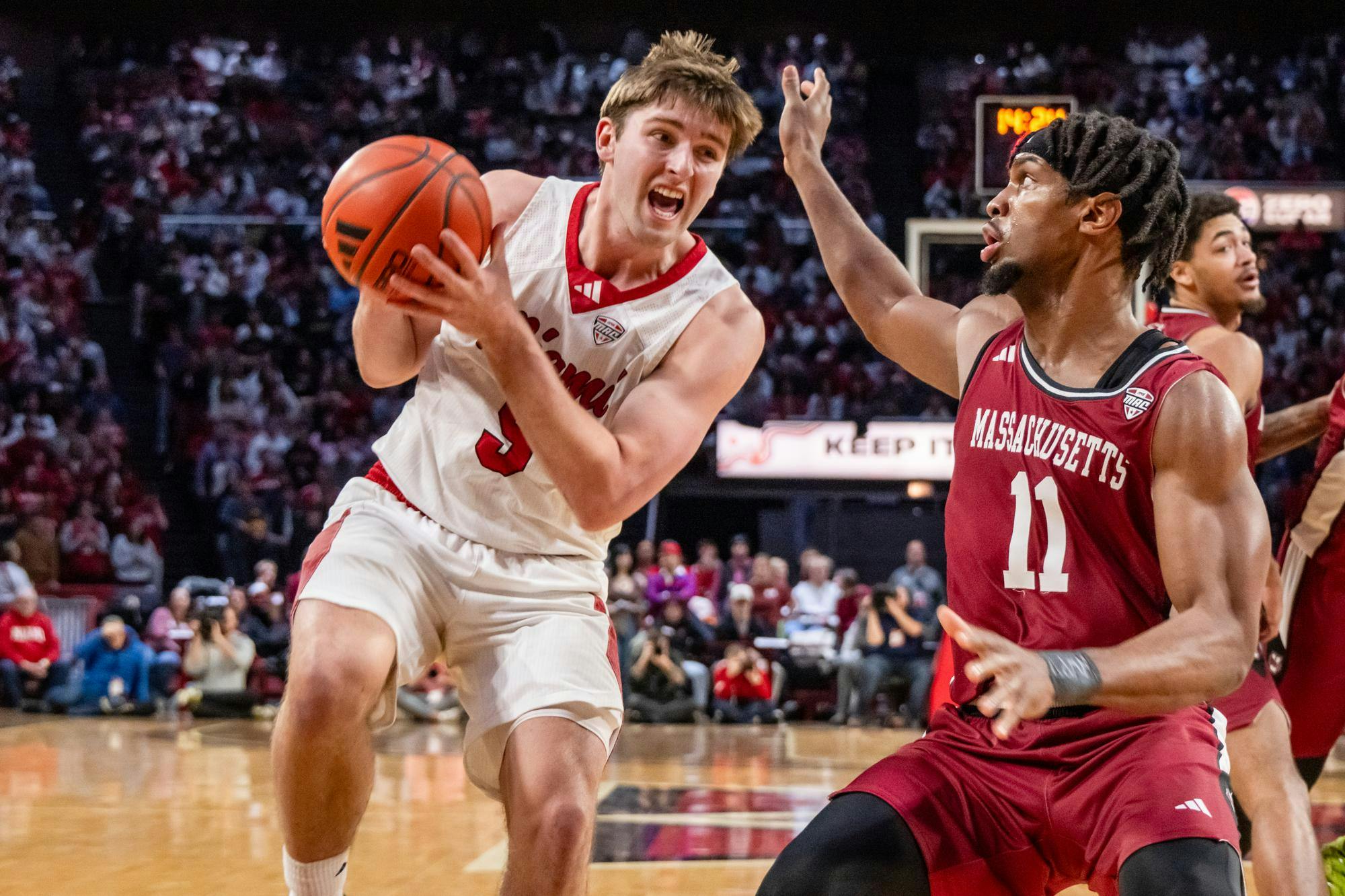 Peter Suder drives for the hoop against UMass at Millett Hall on Jan. 27.