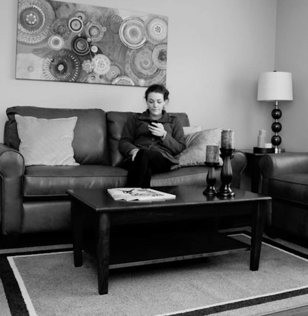 First-year Avery Altman enjoys the renovated Oxford Commons’ living room.