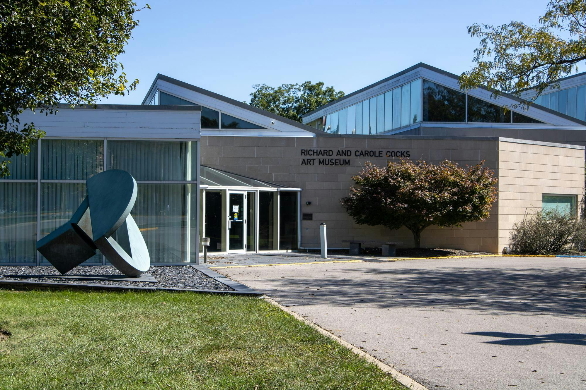 Student walks past the Cook museum sign.