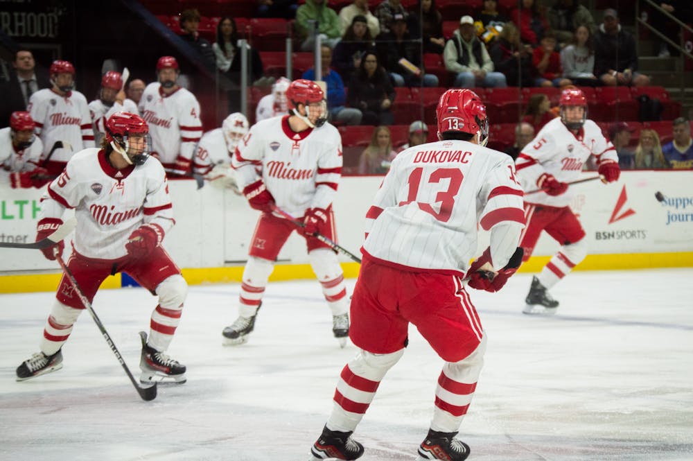 Max Dukovac, William Hallen and Artur Turansky skating in a 2023 game against the Arizona State University Sun Devils