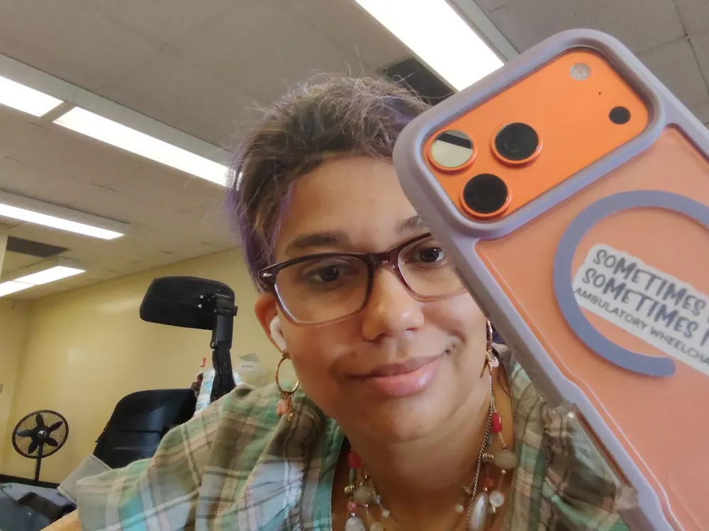 Whitney Wilson-Harris has a sticker on the back of her phone that reads, “Sometimes I walk, Sometimes I roll. Ambulatory Wheelchair User.” Photo provided by Whitney Wilson-Harris