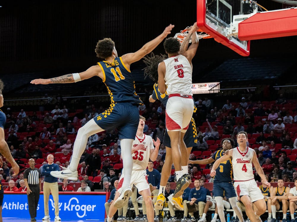 Sophomore wing Eian Elmer goes for a dunk against the Rockets on Feb. 11 at Millett Hall.