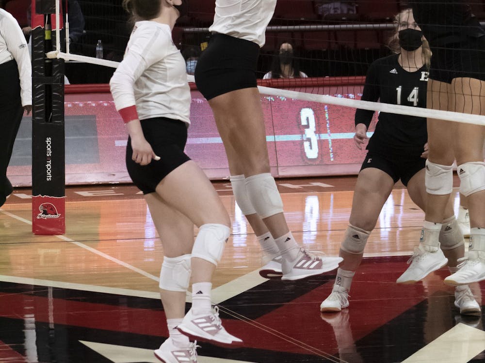 Senior right side Avarie Powell (pictured, middle) gets a block during a weekend series vs. Eastern Michigan.