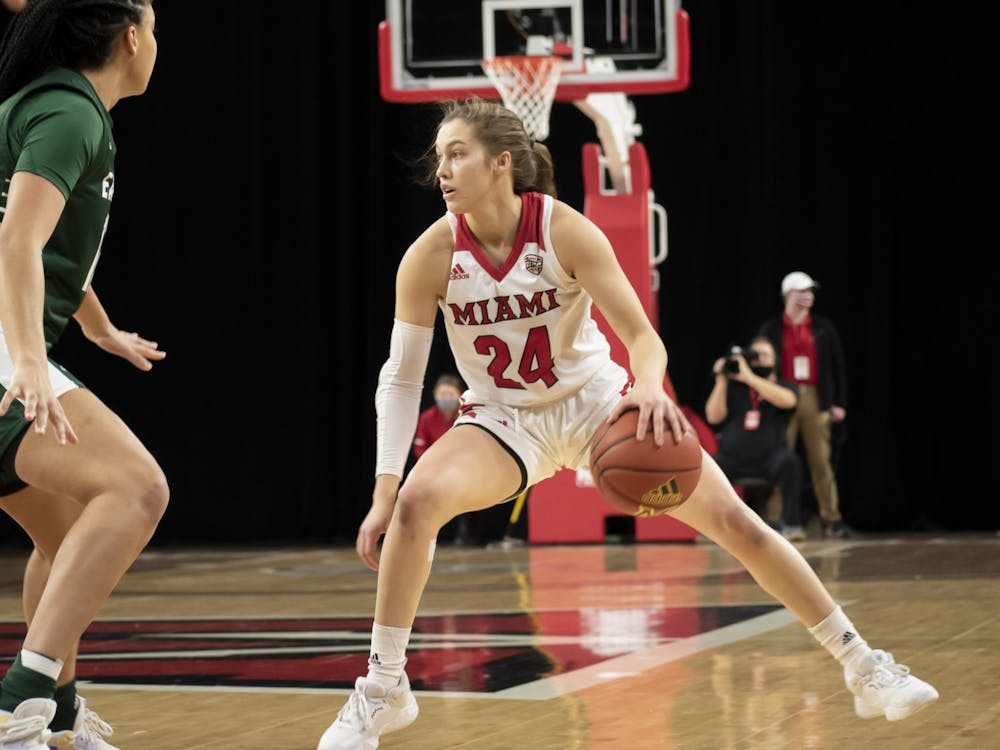 Junior guard Peyton Scott dribbles between her legs during Miami's Jan. 29 loss to Eastern Michigan. Scott scored 32 points in the matchup.