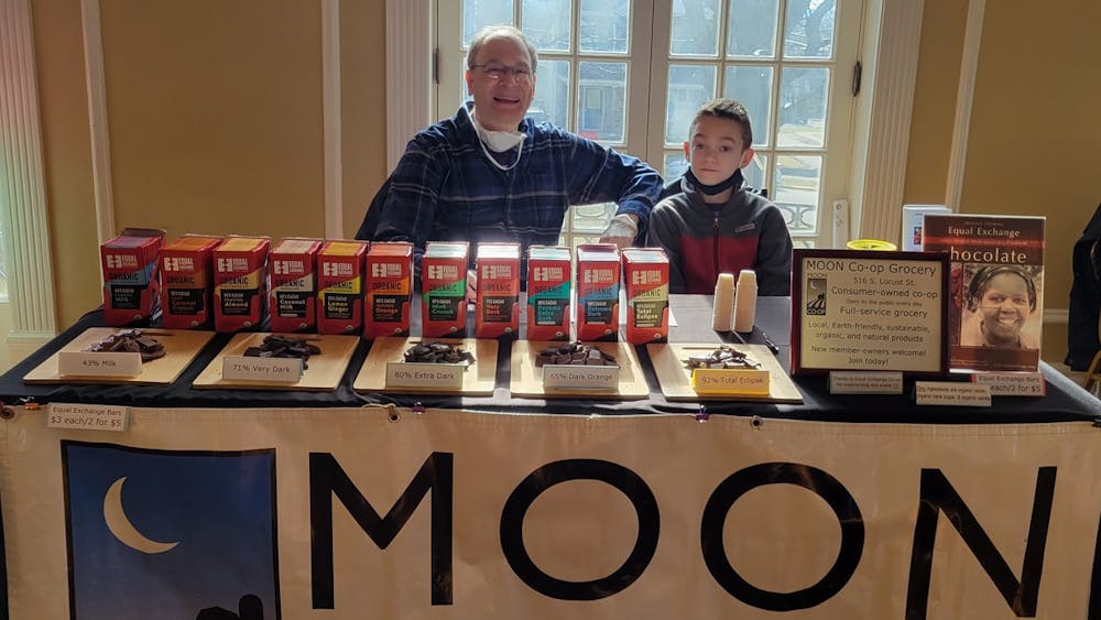 Miles Dumyahn and Jim Rubenstein at MOON Co-op Market's table at Chocolate Table at the Oxford Community Arts Center.