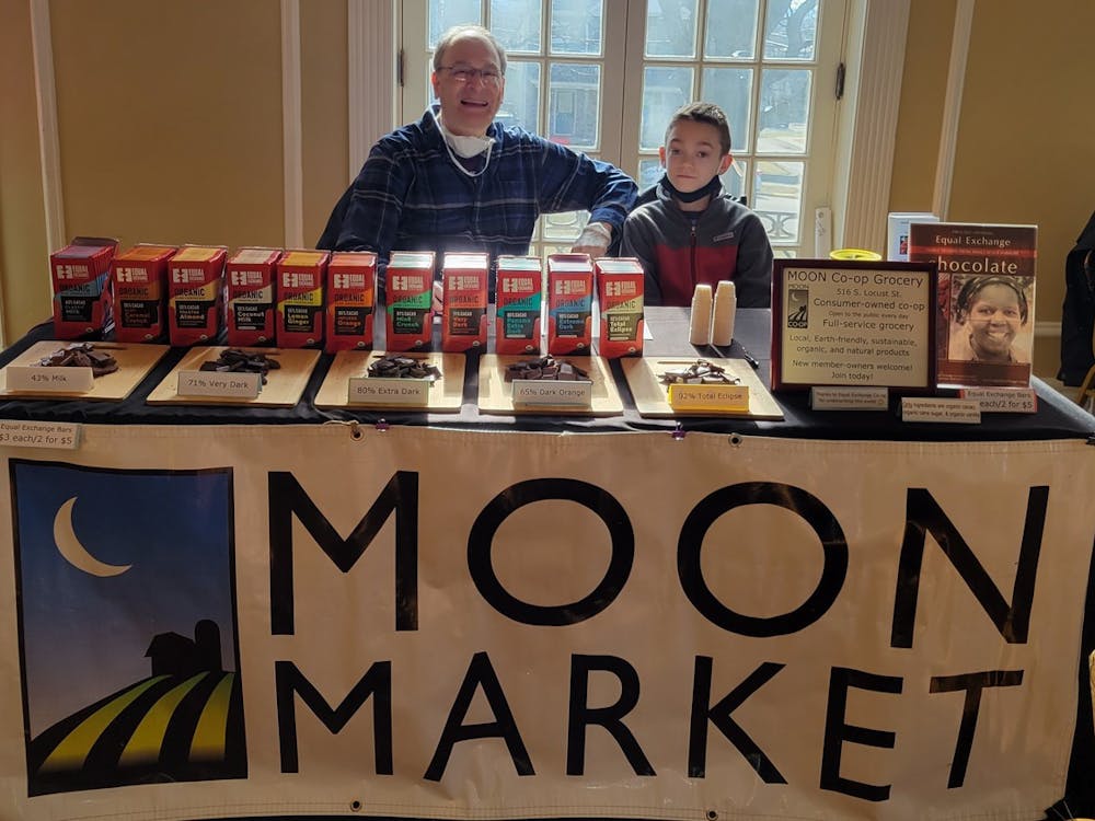 Miles Dumyahn and Jim Rubenstein at MOON Co-op Market's table at Chocolate Table at the Oxford Community Arts Center.