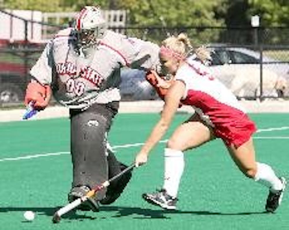 Senior Meghan McMurtry takes on the Ohio State goaltender during Wednesday's field hockey game. The RedHawks had a one goal lead late in the game before giving up the tying goal and eventually losing in overtime.  --Michael Pickering/The Miami Student
