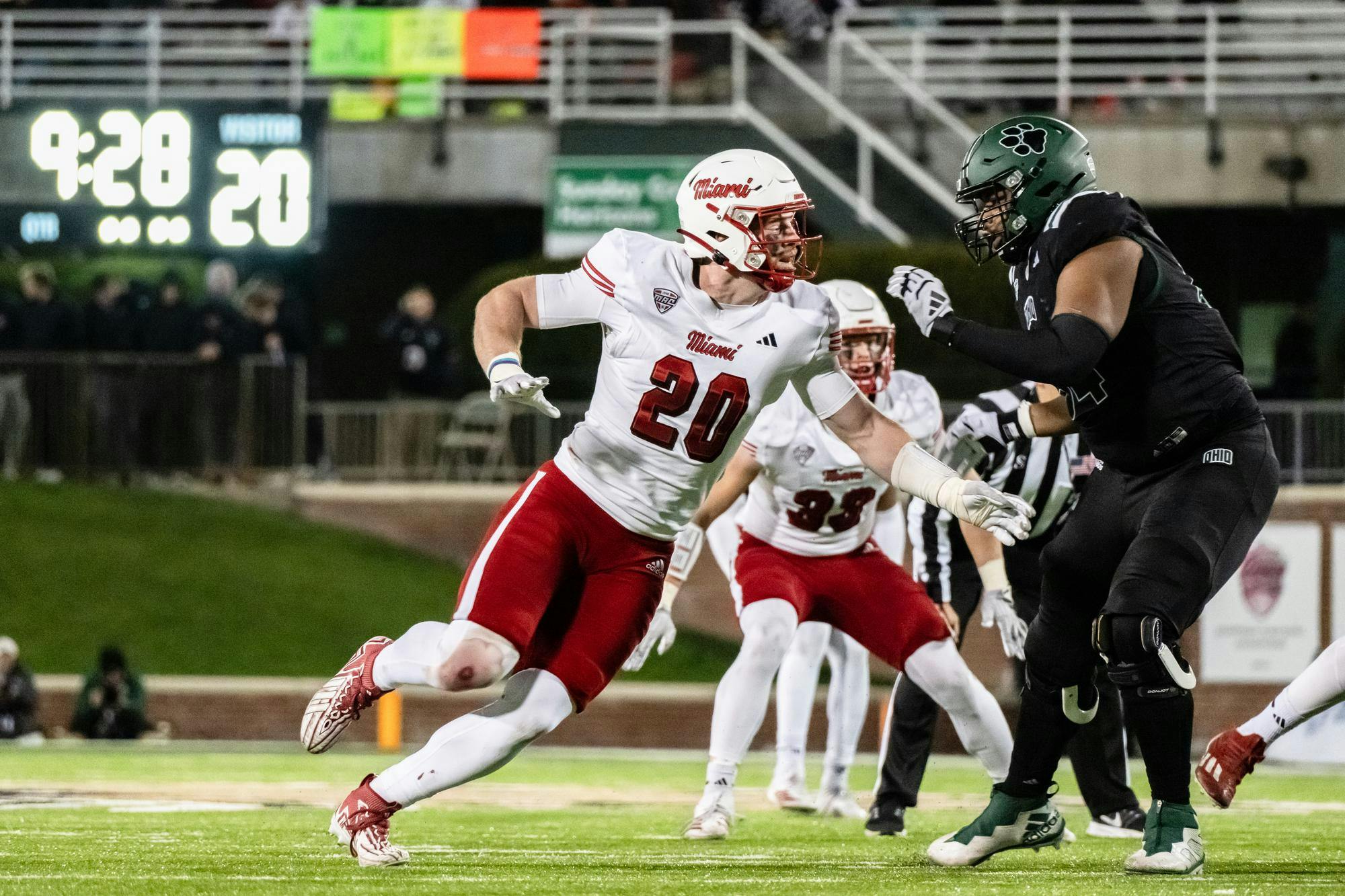 Redshirt senior defensive lineman Adam Trick rushes past his blocker to reach Parker Navarro at Peden Stadium on Nov. 4