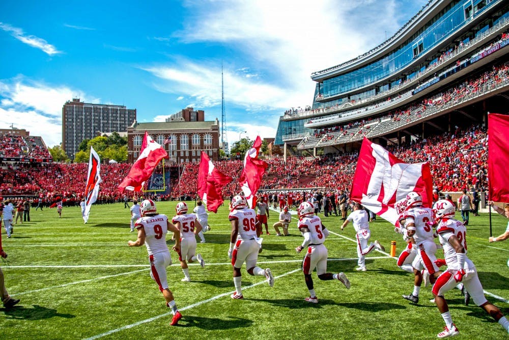 The Miami RedHawks run onto the field at Nippert Stadium before the team&#x27;s 2019 matchup vs. Cincinnati.