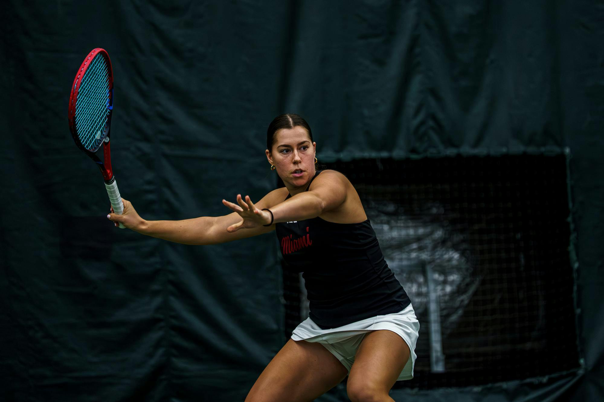 Freshman Maria Komar prepares to return a shot against Butler at Riverside Athletic Club on Feb. 15