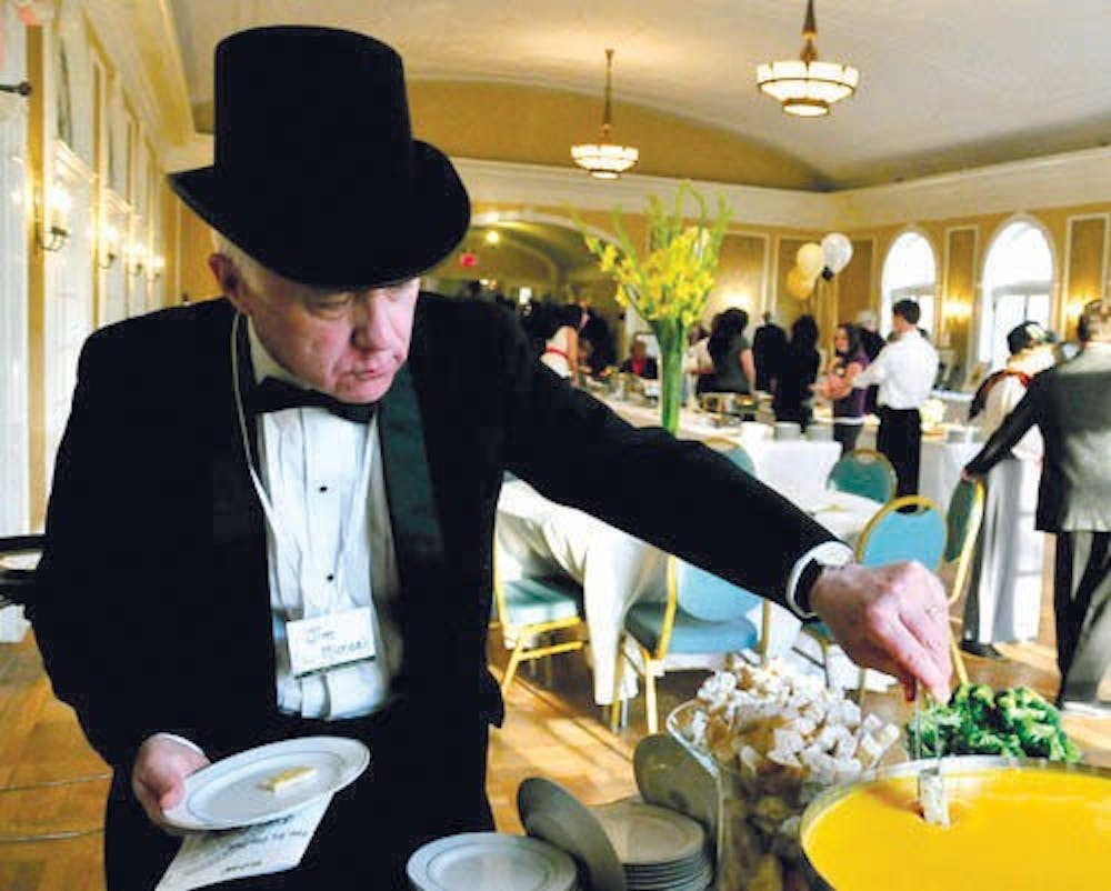 Jim Michael grabs an hors d’oeuvres at the 2010  Oxford Community Arts Gala.
