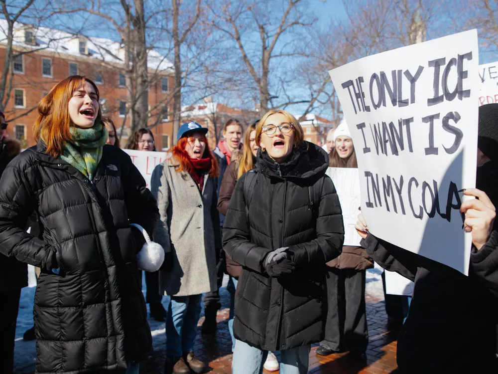 Students protest ICE with posters at the Seal