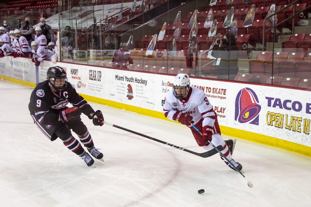 Senior forward Jack Olmstead handles the puck during a 2021 contest vs. St. Cloud State.