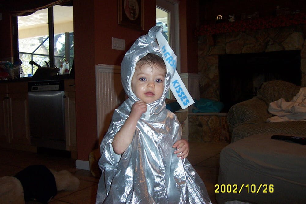 Opinion Editor Ames Radwan, pictured above at age 1.5, went as a Hershey's kiss for Halloween in 2002.