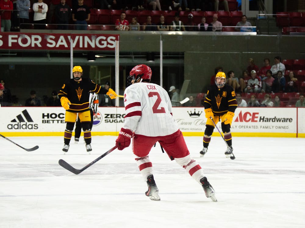 Senior defenseman Spencer Cox skating in a 2023 game against the Arizona State Sun Devils