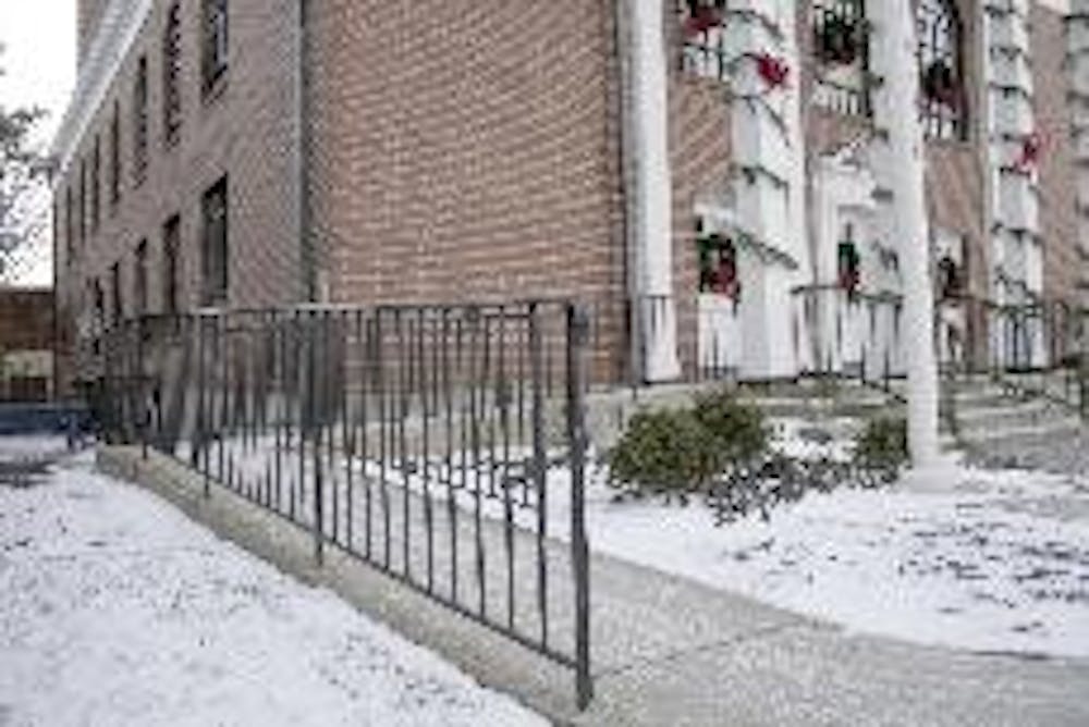 A wheelchair ramp leads to the entrance of the Oxford Municipal Building.  