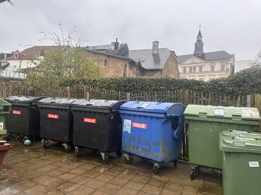 Multi-colored waste bins on Miami’s Luxembourg campus allow students to sort waste more sustainably. 