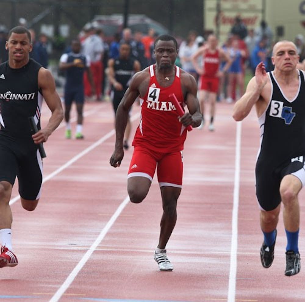 Senior Justinn Eddie (middle) competes in the 4x100 meter relay Saturday at the Miami Invitational. 