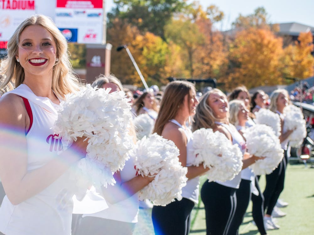 The Miami University Dance Team cheering with the crowd against Central Michigan University.