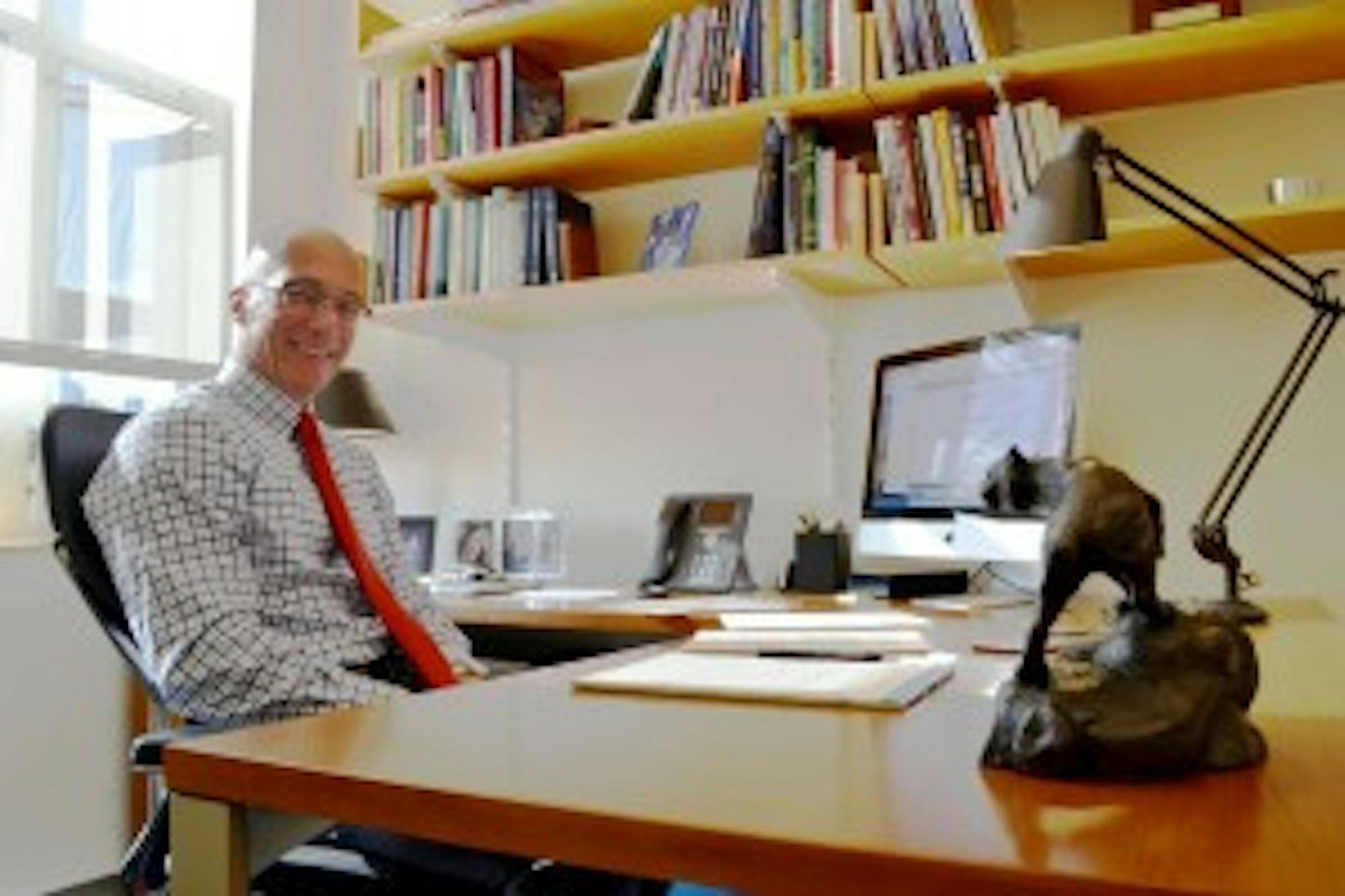Melissa Proulx/STAFF Dan Innis sits at his desk at the University of New Hampshire once again. The former dean of the Paul College of Business and Economics left his position overseeing the college at UNH to run for Congress recently, losing the 1st district Congressional Republican primary 49-41 percent to Frank Guinta.