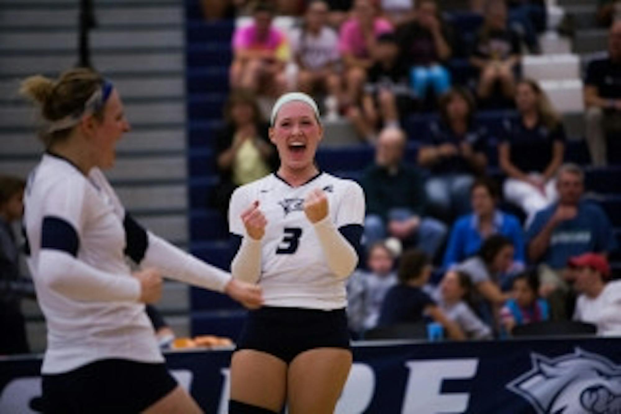 Cameron Johnson/Staff Tayor Dunklau (3) and Cassidy Croci celebrate along the way to a sweep.
