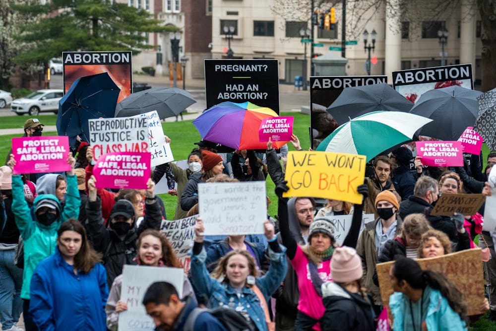 <p>Protestors block anti-abortion protestors with their signs and umbrellas. Planned Parenthood held a pro-choice rally at the Michigan Capitol on May 3, 2022, following news of the Supreme Court&#x27;s intention to overturn Roe v. Wade.</p>
