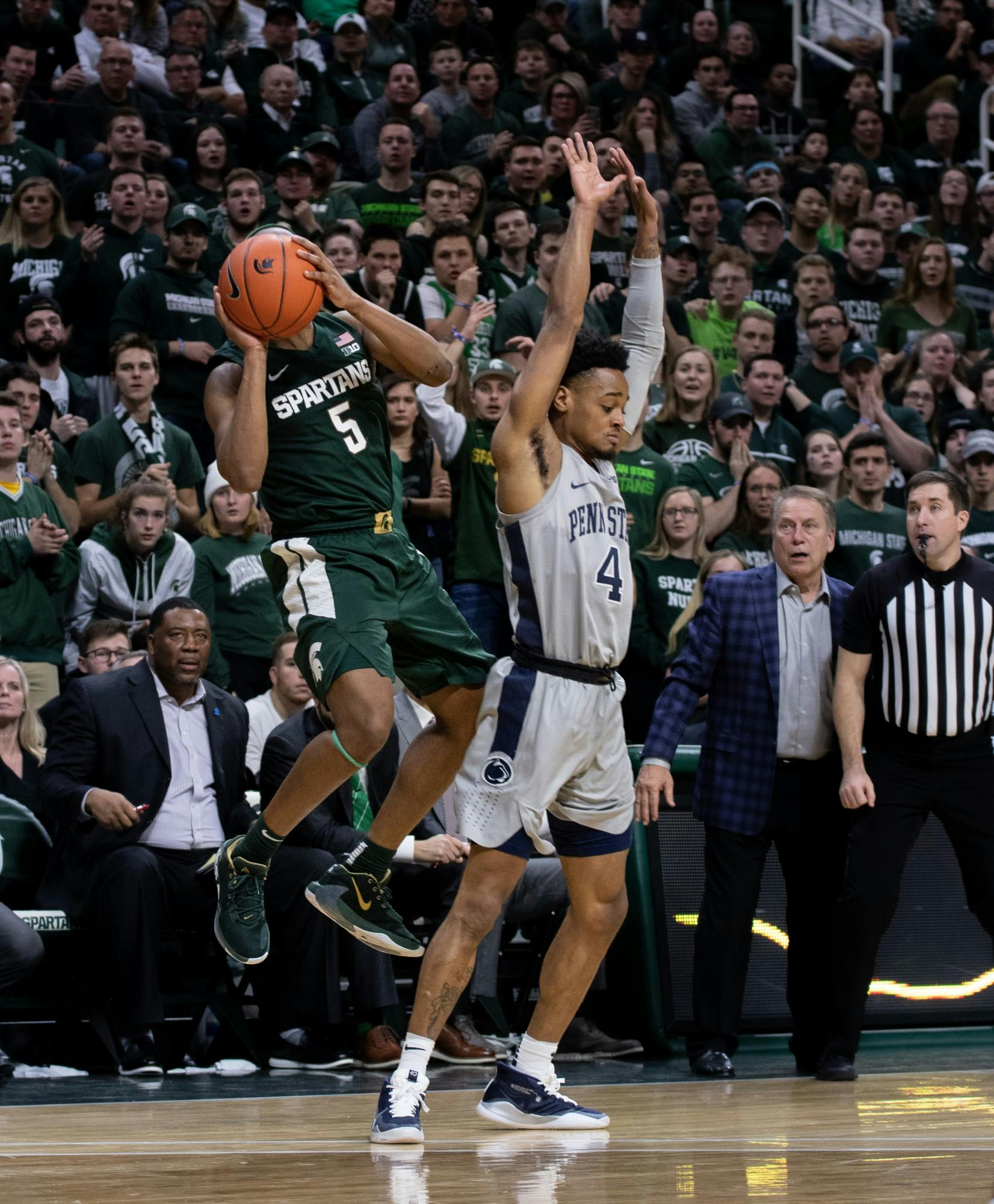 Cassius Winston (5) takes a shot in the final seconds of a basketball game against Penn State at the Breslin Center on Feb. 4, 2020. The Spartans fell to the Nittany Lions, 70-75.