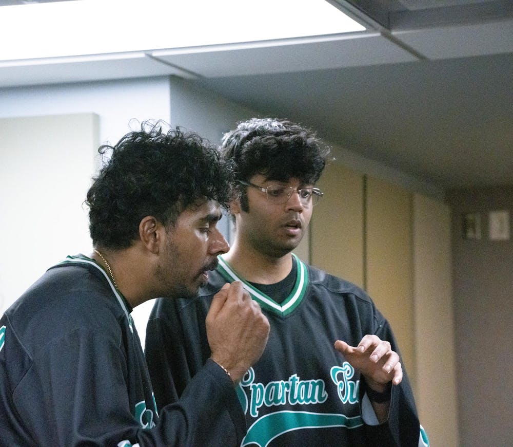 <p>Members of Michigan State University’s A Cappella group, Spartan Sur practice during a rehearsal in Sny-Phi on April 3, 2024.&nbsp; </p>