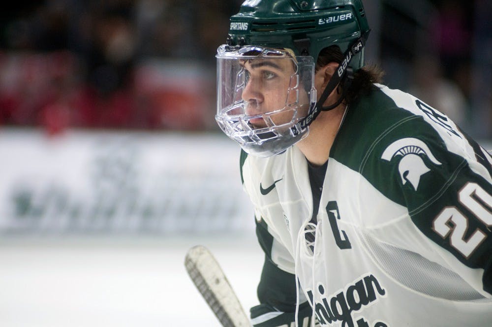 Senior forward Michael Ferrantino looks at his opponent during the third period of the game against Wisconsin on Dec. 12, 2015 at Munn Ice Arena. The Spartans were defeated by the Badgers, 3-0.