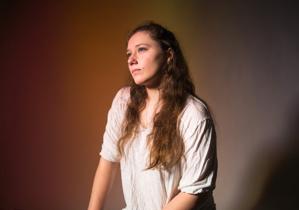 Computer science junior Jillian Tosolt poses under studio lights on Feb. 12, 2019.