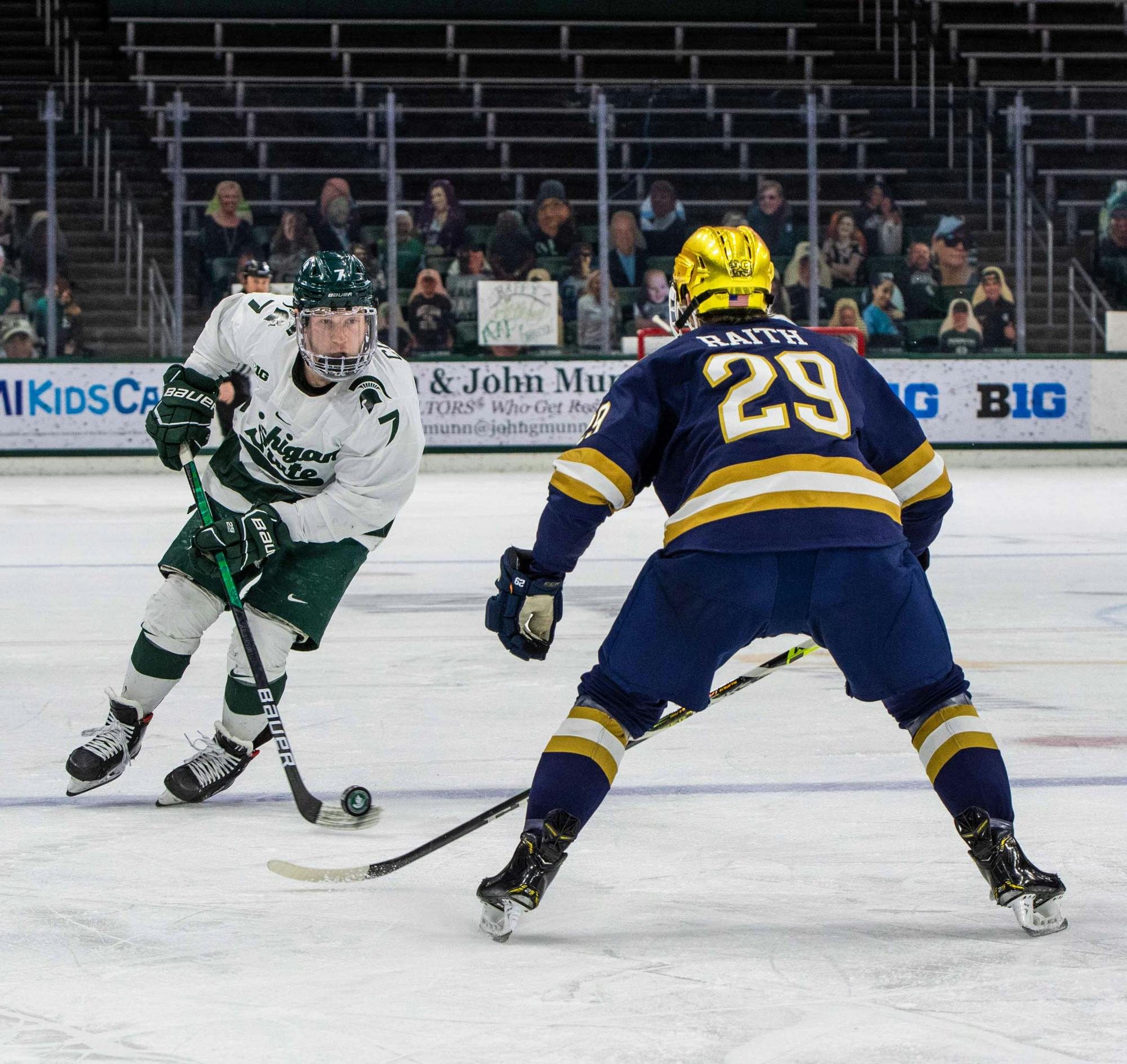 <p>Graduate student Charlie Combs (7) stares down a Notre Dame defender in the first period. The Fighting Irish shut out the Spartans, 2-0, on Feb. 27, 2021.</p>
