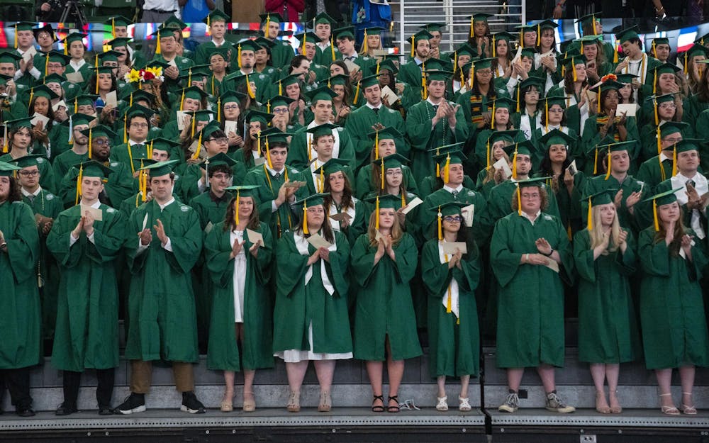 The College of Natural Science graduates clap as the department honored Alexandria Verner and Arielle Anderson with posthumous degrees accepted by Verner’s god mother and Anderson’s sister on their behalf at the 2023 commencement ceremony on Saturday, May 6, 2023 at the Breslin Center.