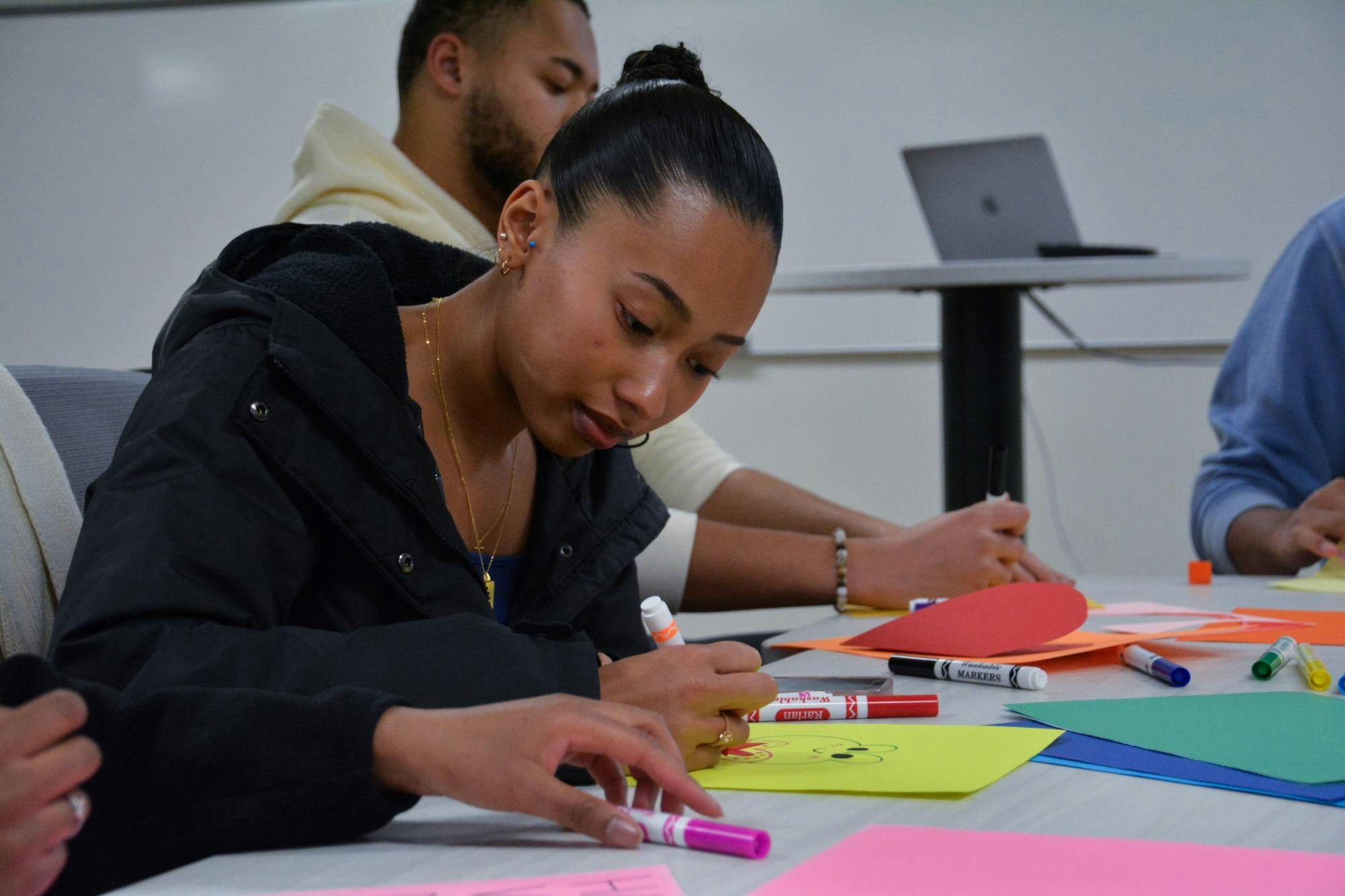 <p>A student decorates her card with a colorful design, Jan. 19, 2024.</p>